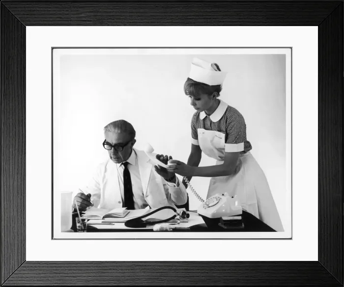 Framed Print : Doctor Checks his Diary Framed Print : Doctor Checks his Diary