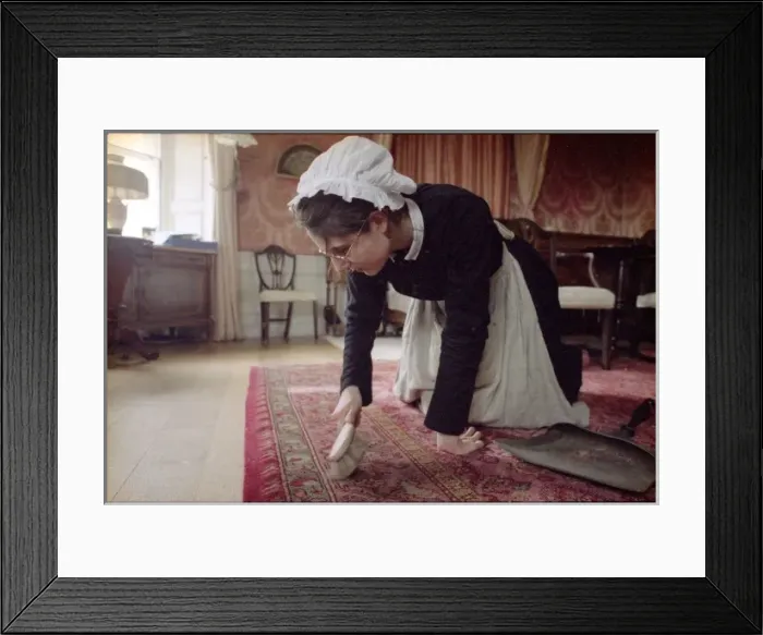 Framed Print : Housemaid Brushes Carpet Framed Print : Housemaid Brushes Carpet