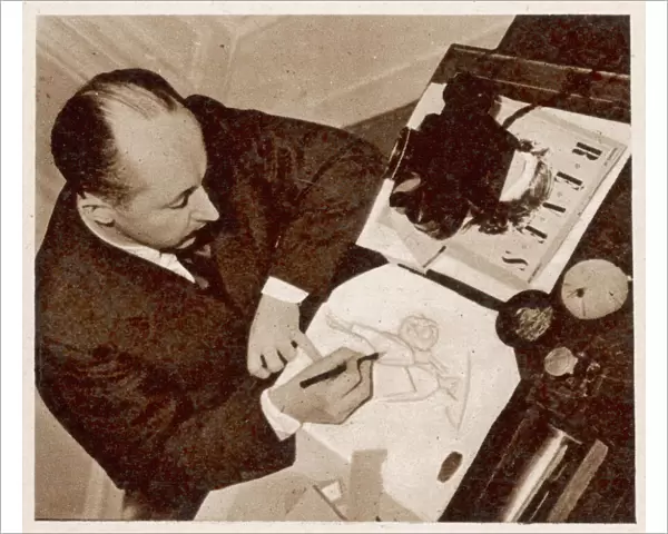 Christian Dior sketching a fashion design, 1948