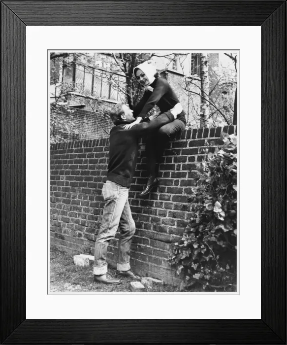 Framed Print : Climbing over a Wall Framed Print : Climbing over a Wall