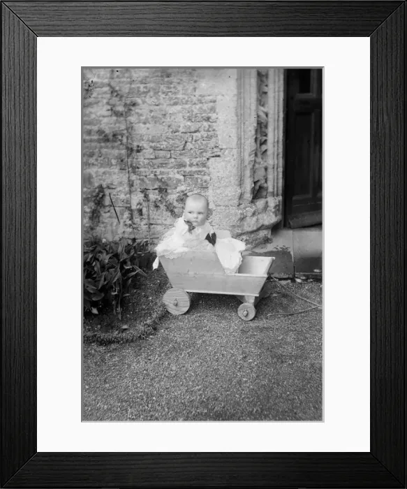 Framed Print : Baby in Wooden Cart Framed Print : Baby in Wooden Cart