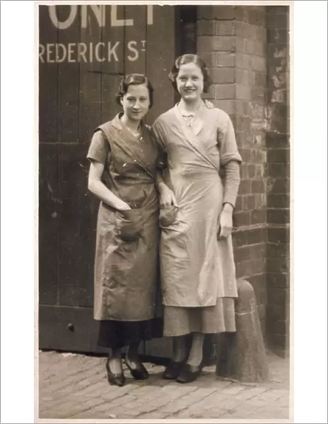 Two women workers at the factory gates, Derby