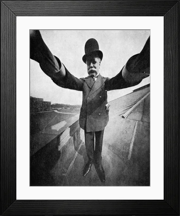 Framed Print : Photographer holding a Sky-scraper camera on the roof of a Framed Print : Photographer holding a Sky-scraper camera on the roof of a