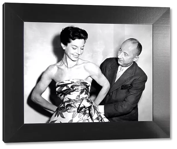 Christian Dior with model Dorothy Emms, 1952