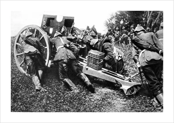 On the Belgian Frontier: German field guns being run forward to open fire