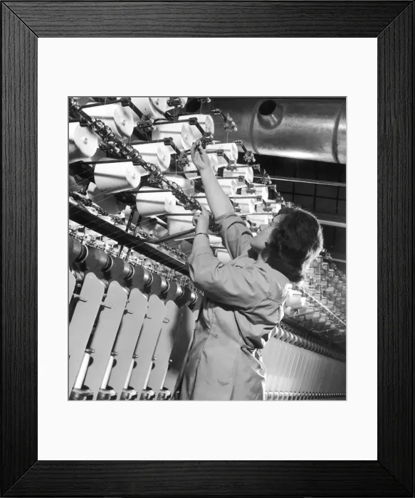 Framed Print : Factory employee checks large Spinning Machine Framed Print : Factory employee checks large Spinning Machine