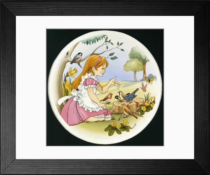 Framed Print : A young girl feeds the birds Framed Print : A young girl feeds the birds