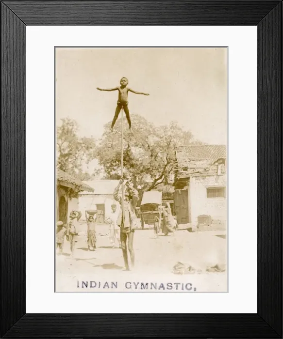 Framed Print : Indian child gymnast atop a long pole Framed Print : Indian child gymnast atop a long pole