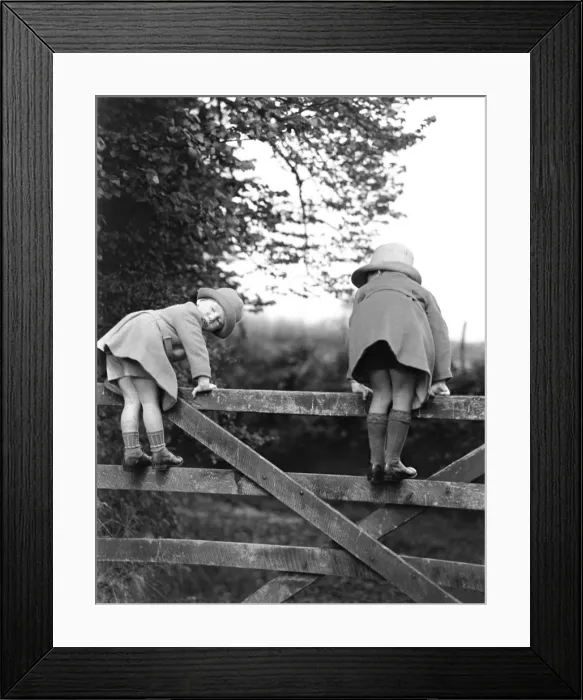 Framed Print : Two children play on a fence - Devon Framed Print : Two children play on a fence - Devon