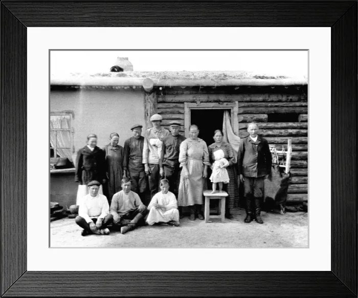 Framed Print : Unidentified group outside a hut Framed Print : Unidentified group outside a hut
