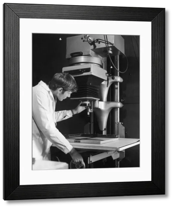 Framed Print : Vertical Projector at a print works Framed Print : Vertical Projector at a print works