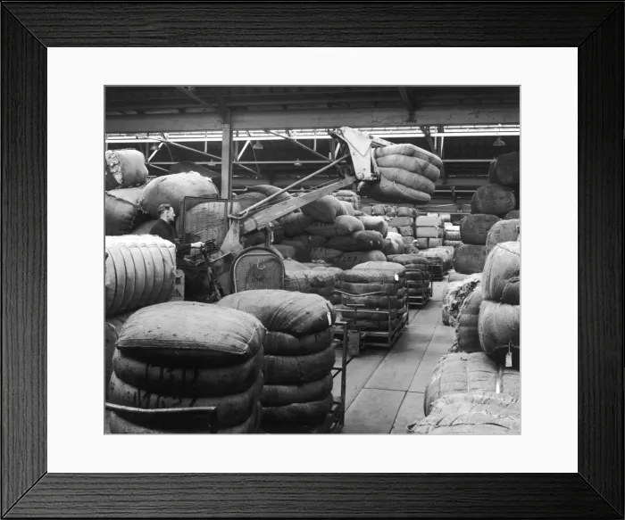 Framed Print : Moving large sacks in a warehouse Framed Print : Moving large sacks in a warehouse