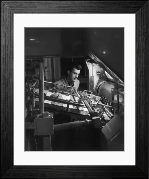Framed Print : Printing Machine Operator checks a proof Framed Print : Printing Machine Operator checks a proof