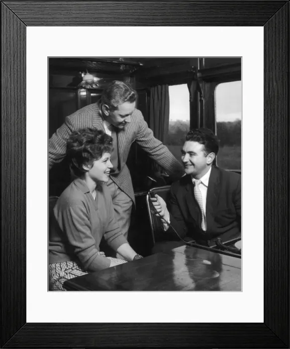 Framed Print : Couple are Interviewed on a Train Framed Print : Couple are Interviewed on a Train