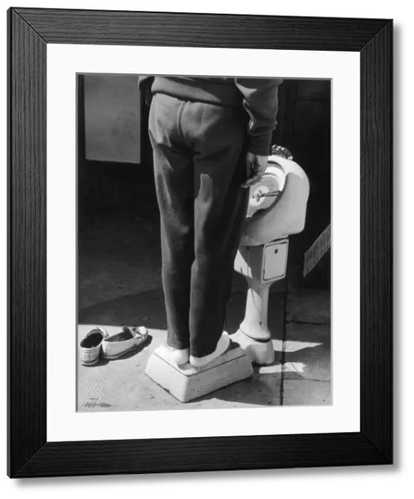 Framed Print : Weighing Scales in Use Framed Print : Weighing Scales in Use
