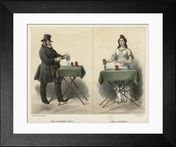 Framed Print : Man and woman magicians performing tricks at table Framed Print : Man and woman magicians performing tricks at table
