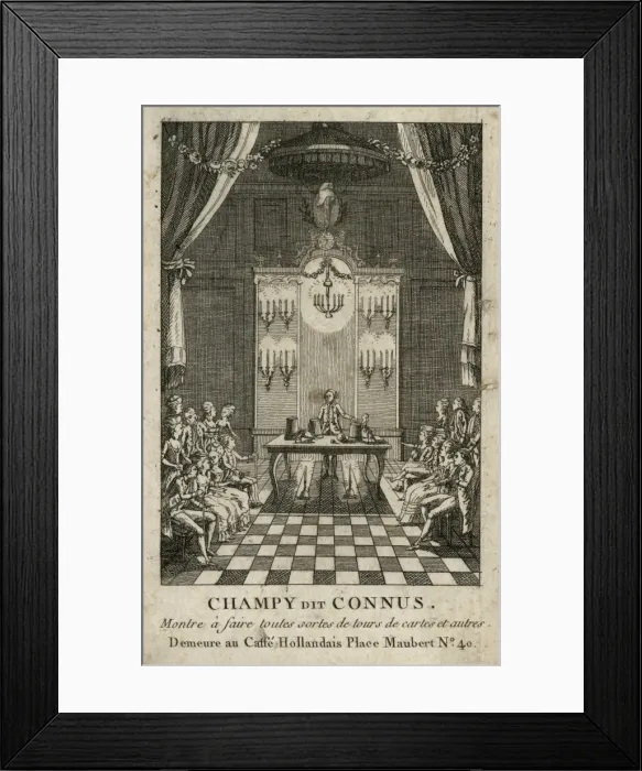 Framed Print : Magician performing the cup and balls trick in front of a se Framed Print : Magician performing the cup and balls trick in front of a se