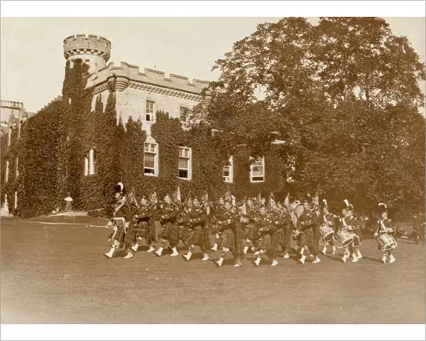 View of Tulloch Castle, Scotland, with pipers