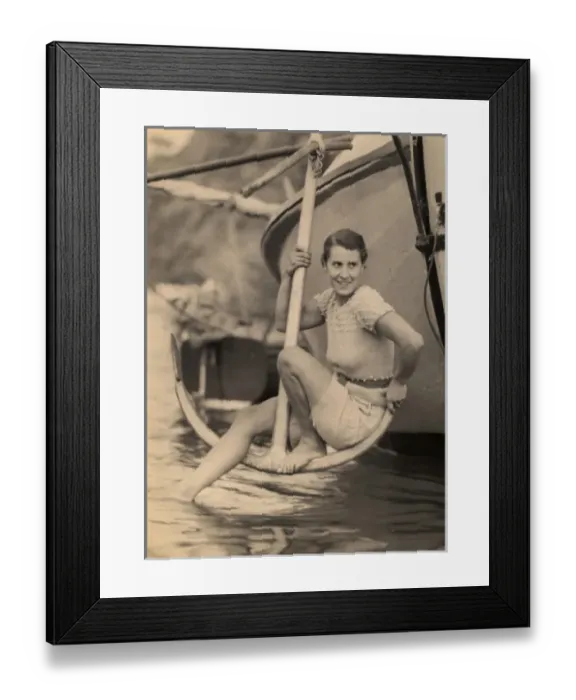 Framed Print : Woman poses on anchor Framed Print : Woman poses on anchor