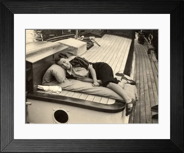 Framed Print : Woman asleep on board boat Framed Print : Woman asleep on board boat