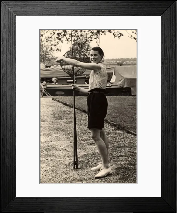Framed Print : Woman poses with fishing nets Framed Print : Woman poses with fishing nets
