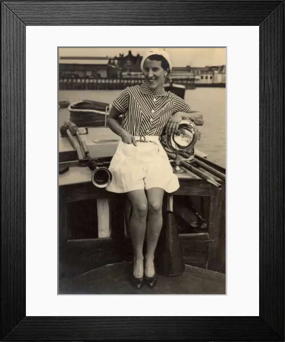 Framed Print : Woman poses on boat, 1930s Framed Print : Woman poses on boat, 1930s