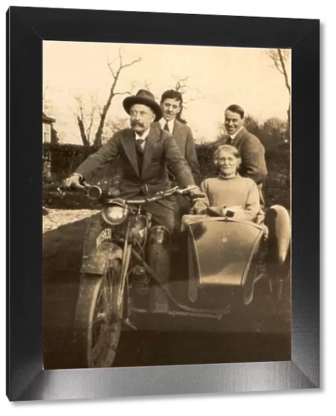 Elderly couple in motorbike and sidecar