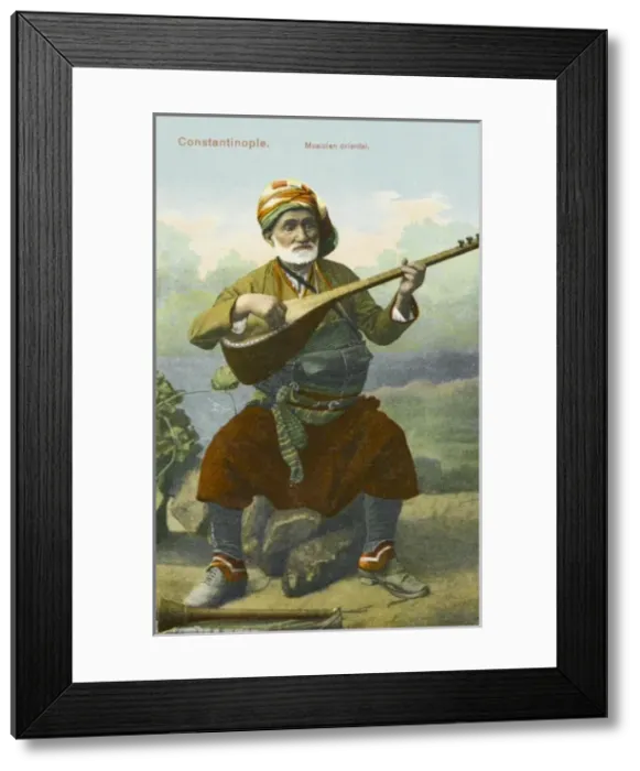 Framed Print : Turkish musician playing traditional instrument Framed Print : Turkish musician playing traditional instrument