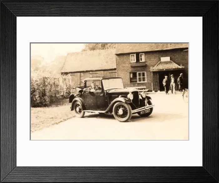 Framed Print : Small half-convertible car