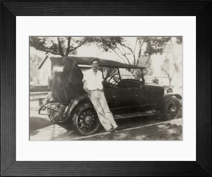 Framed Print : Leaning against his motor