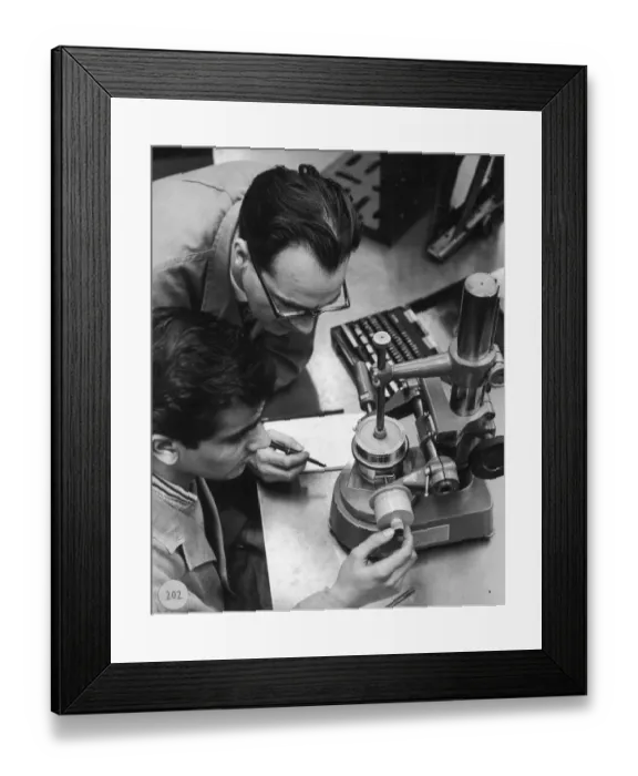 Framed Print : Two engineers using a measurement device Framed Print : Two engineers using a measurement device