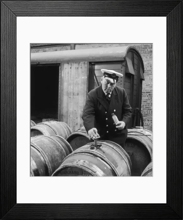 Framed Print : Customs official tests imported wine Framed Print : Customs official tests imported wine