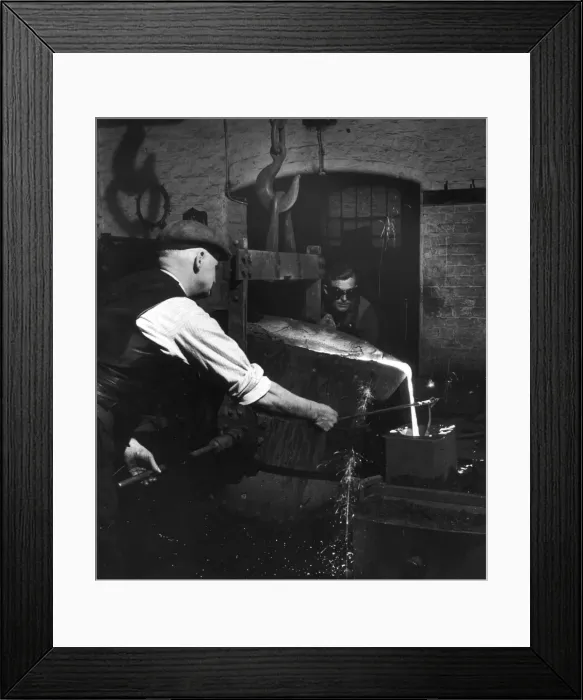 Framed Print : Molten metal is poured in to a mould Framed Print : Molten metal is poured in to a mould