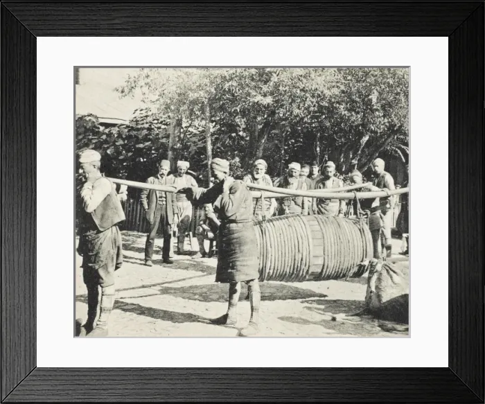 Framed Print : Porters carrying a large barrel on two long yolks Framed Print : Porters carrying a large barrel on two long yolks