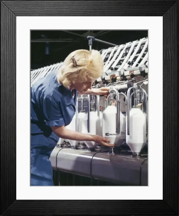Framed Print : A Machine Collects Woollen Thread on spools Framed Print : A Machine Collects Woollen Thread on spools