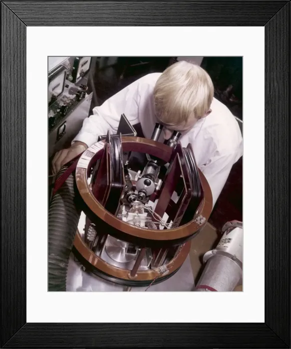Framed Print : A technician doing miniature work Framed Print : A technician doing miniature work