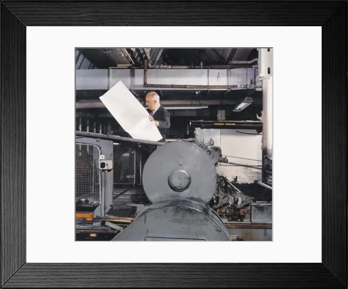 Framed Print : A printer checking a large proof Framed Print : A printer checking a large proof
