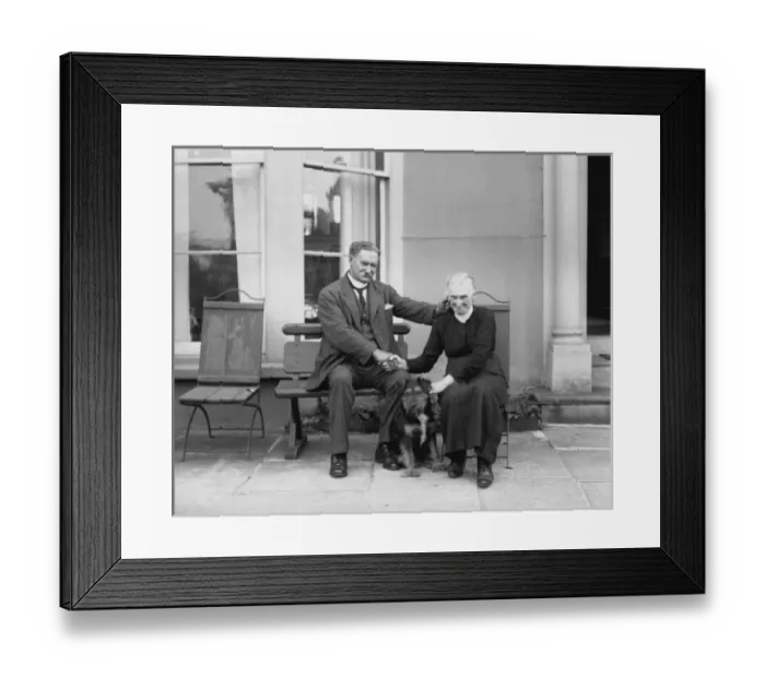 Framed Print : An elderly couple holding hands outside their house Framed Print : An elderly couple holding hands outside their house