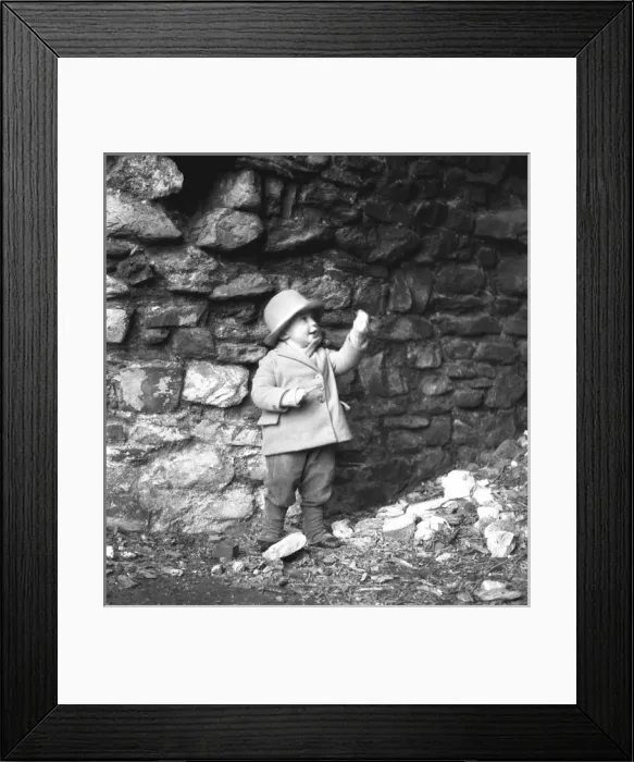Framed Print : Small boy in front of a wall Framed Print : Small boy in front of a wall