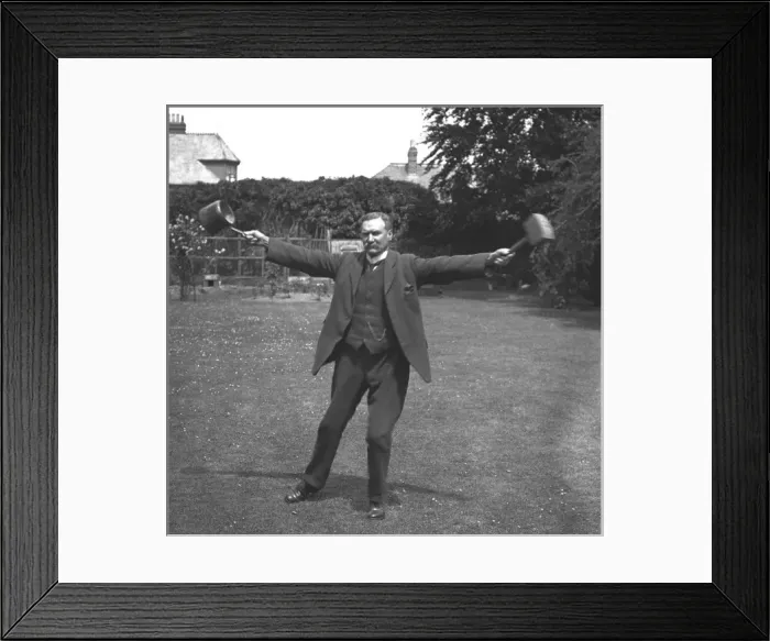 Framed Print : Man with pan and mallet Framed Print : Man with pan and mallet
