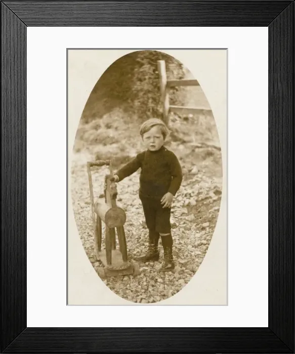 Framed Print : Young boy and his toy horse Framed Print : Young boy and his toy horse