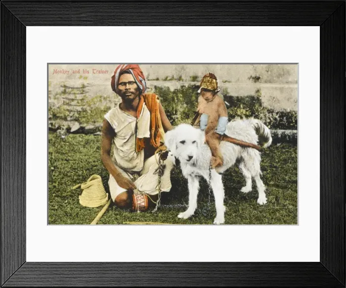 Framed Print : Blind Trainer with a Monkey (riding a white dog) - India Framed Print : Blind Trainer with a Monkey (riding a white dog) - India