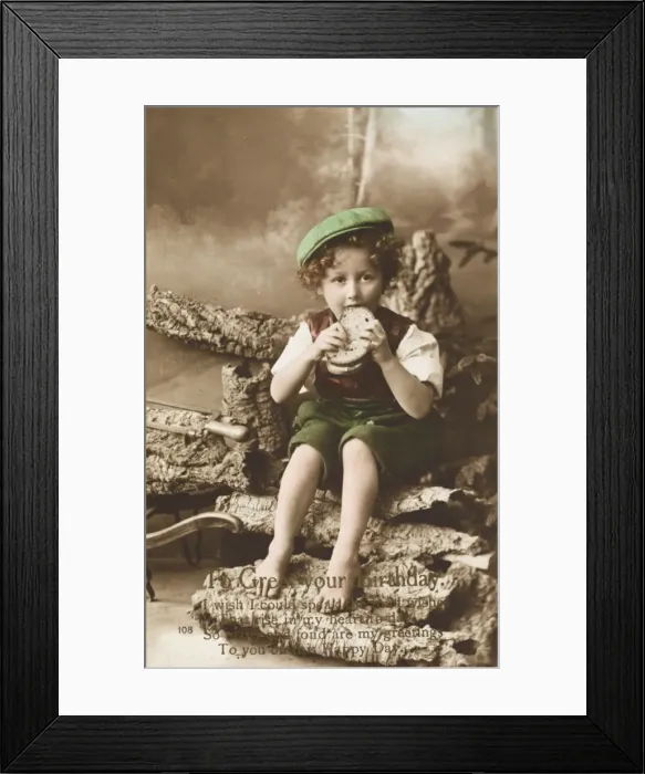 Framed Print : Young boy eating a large sandwich Framed Print : Young boy eating a large sandwich