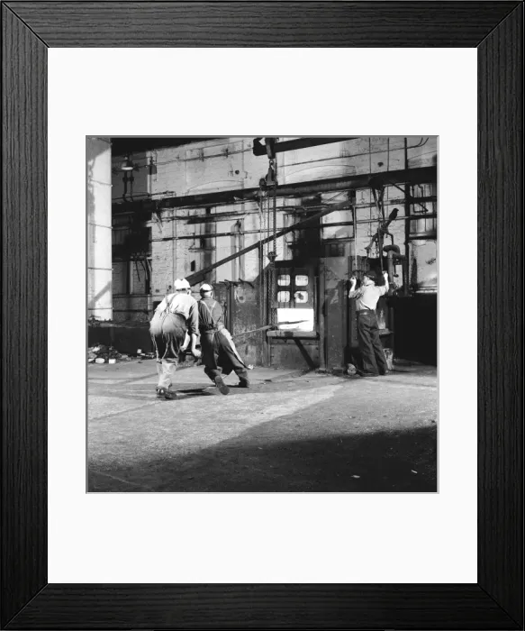 Framed Print : Tempering a long metal bar Framed Print : Tempering a long metal bar