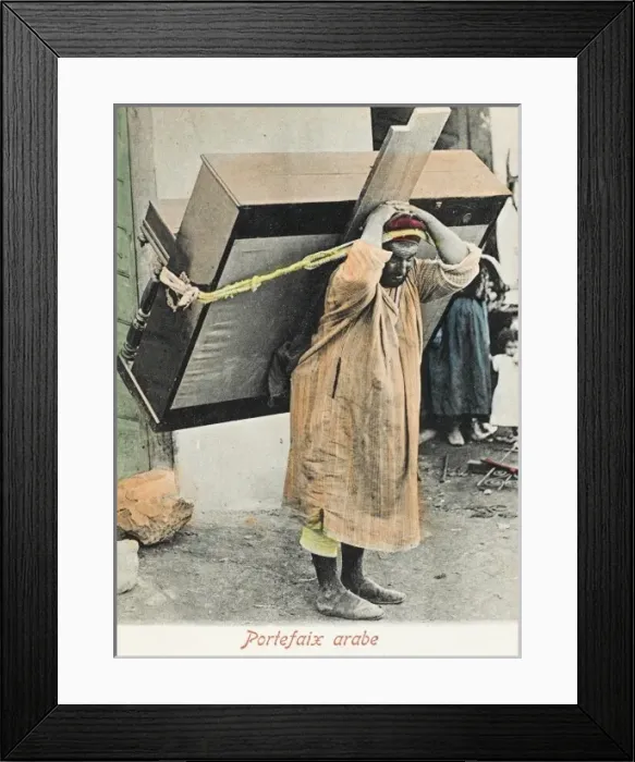 Framed Print : Porter Carrying an upright piano - Tunisia Framed Print : Porter Carrying an upright piano - Tunisia