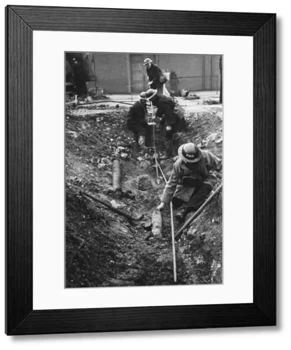 Framed Print : Extinguishing a fire WWII Framed Print : Extinguishing a fire WWII