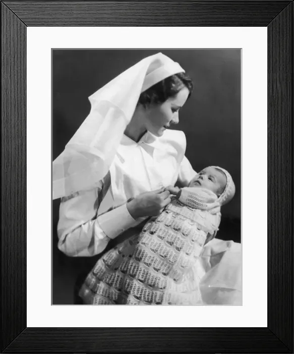 Framed Print : Nurse holding baby Framed Print : Nurse holding baby