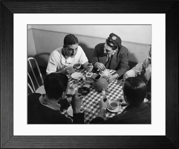 Framed Print : Doctor relaxes with ambulance staff Framed Print : Doctor relaxes with ambulance staff