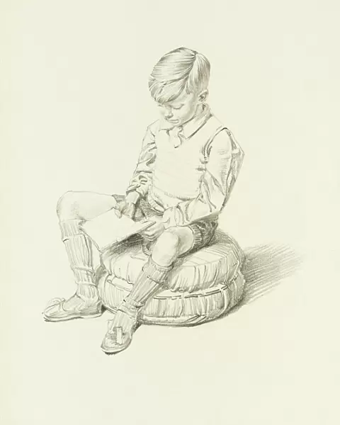 Boy sitting and reading