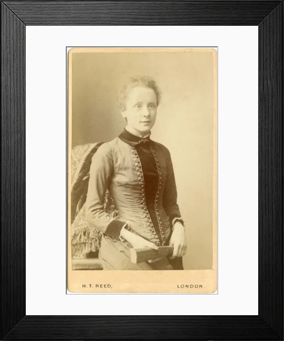 Framed Print : Young Victorian woman holding a folded fan Framed Print : Young Victorian woman holding a folded fan